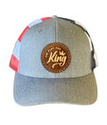 Gray and red cap with a brown leather patch on a white background