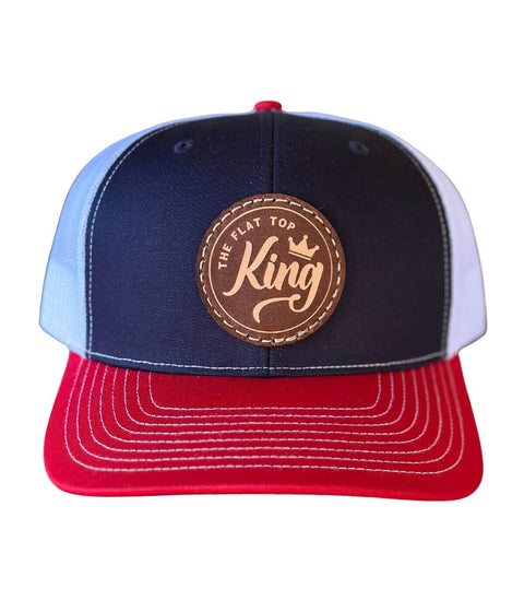 Blue and red cap with a brown leather patch on a white background
